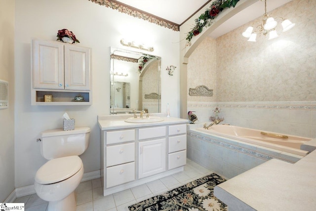 bathroom featuring toilet, tiled tub, a notable chandelier, tile patterned floors, and vanity