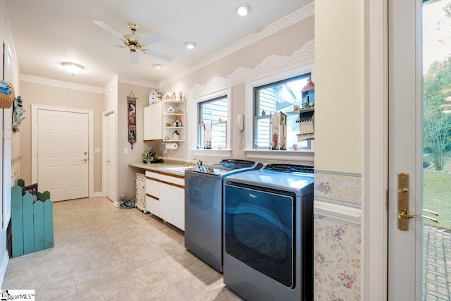 clothes washing area with cabinets, separate washer and dryer, sink, and ceiling fan