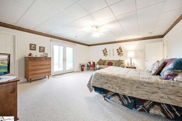 bedroom with carpet, french doors, ornamental molding, access to outside, and ceiling fan