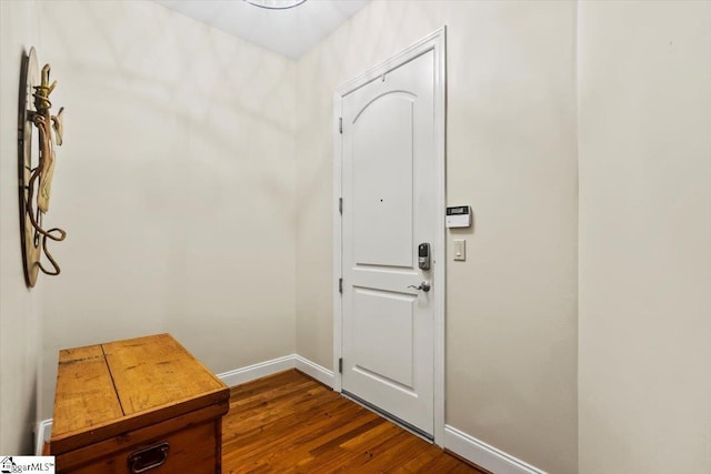 doorway to outside with dark wood-type flooring