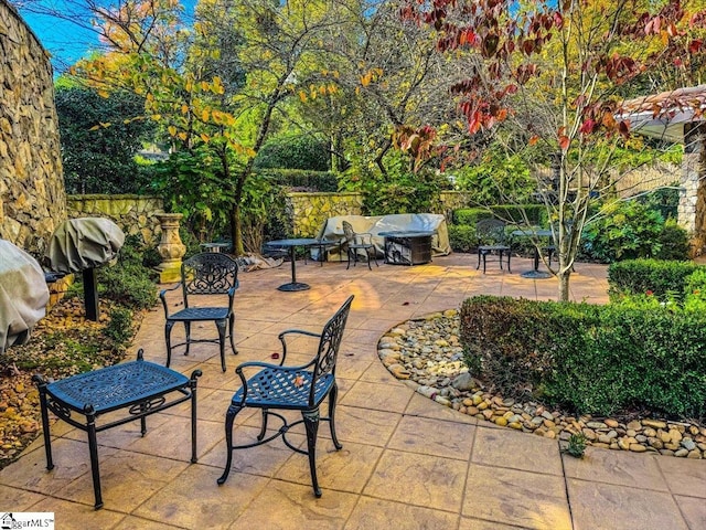 view of patio with a grill