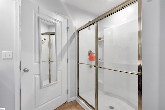 bathroom featuring tile patterned floors and walk in shower