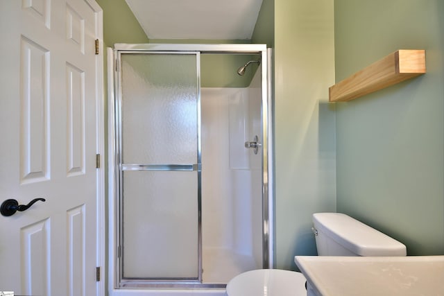 bathroom with walk in shower and toilet