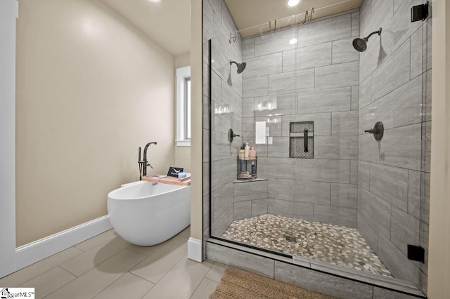 bathroom featuring separate shower and tub and tile patterned flooring