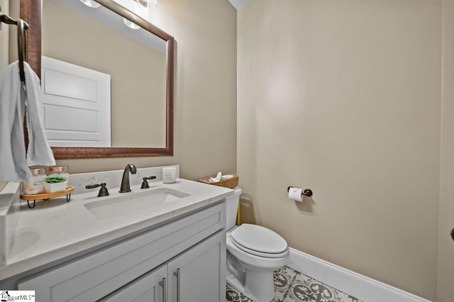 bathroom with toilet and vanity