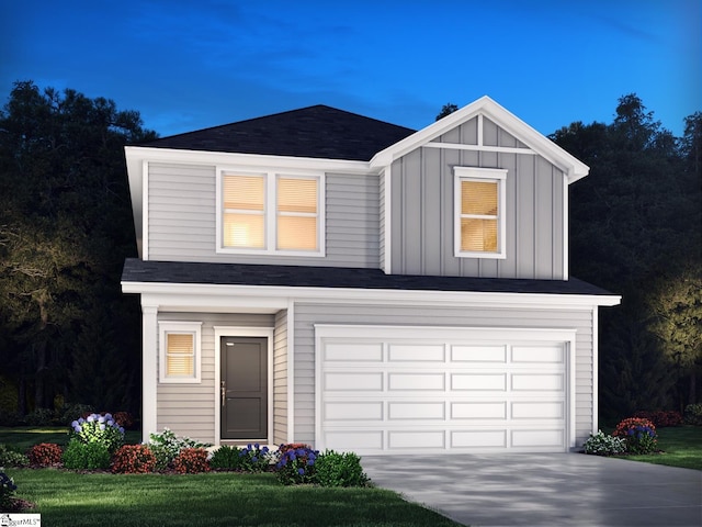 view of front facade featuring a front yard and a garage