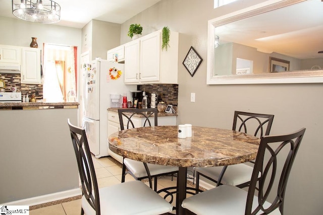 dining room featuring light tile patterned floors