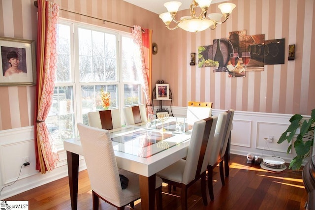 dining room featuring a chandelier and hardwood / wood-style floors