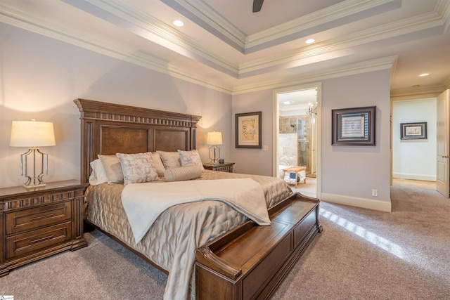 carpeted bedroom with ceiling fan with notable chandelier, crown molding, connected bathroom, and a raised ceiling