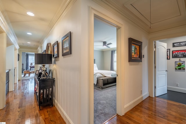 hallway with carpet floors, plenty of natural light, and crown molding