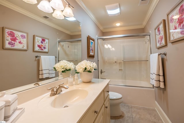 full bathroom featuring tile patterned flooring, vanity, toilet, ornamental molding, and combined bath / shower with glass door