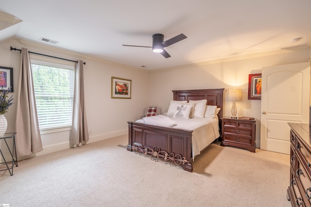 bedroom featuring ceiling fan, light carpet, crown molding, and lofted ceiling