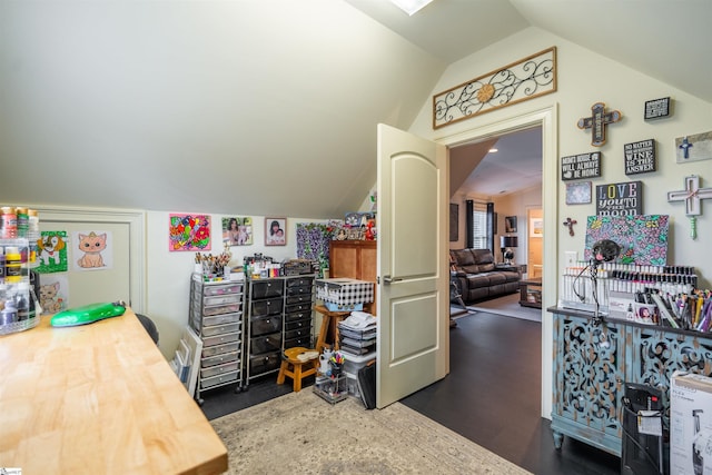 office featuring vaulted ceiling and dark hardwood / wood-style floors