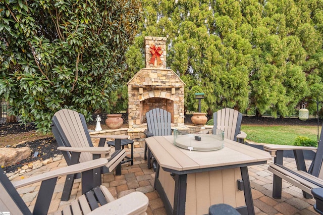 view of patio with an outdoor stone fireplace