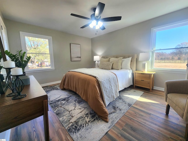 bedroom with ceiling fan and hardwood / wood-style floors