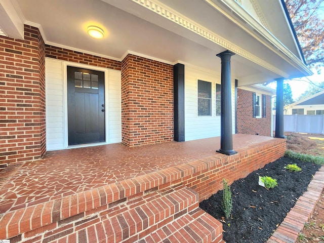 doorway to property featuring covered porch