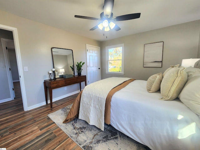 bedroom featuring ceiling fan and dark wood-type flooring