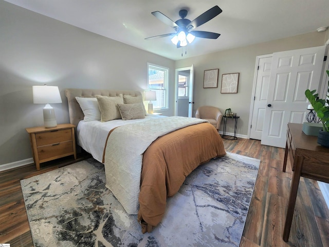 bedroom featuring ceiling fan and dark hardwood / wood-style flooring