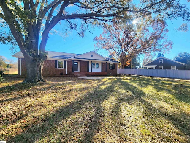 back of house featuring a yard