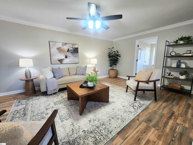 living room featuring ceiling fan, dark hardwood / wood-style floors, and crown molding