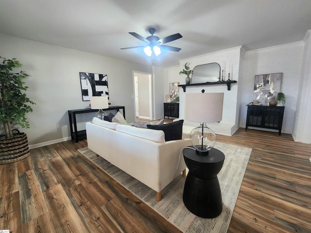 living room featuring ceiling fan and dark wood-type flooring