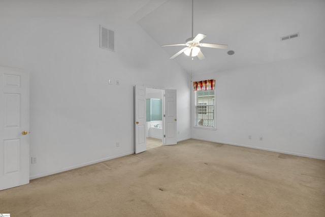 unfurnished room with light carpet, ceiling fan, and high vaulted ceiling