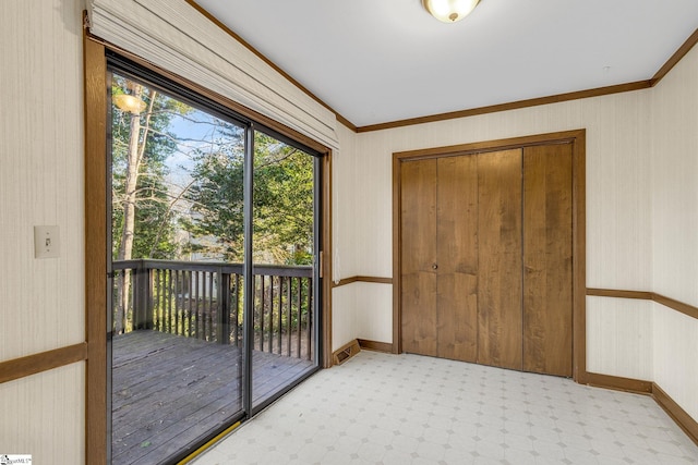 doorway featuring crown molding