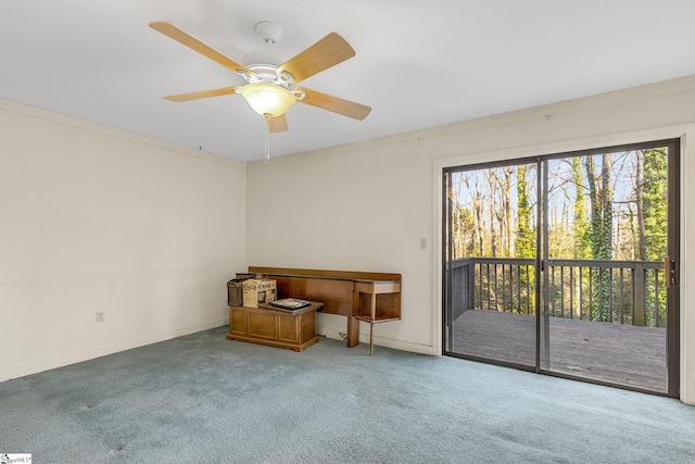 carpeted empty room featuring ceiling fan and ornamental molding