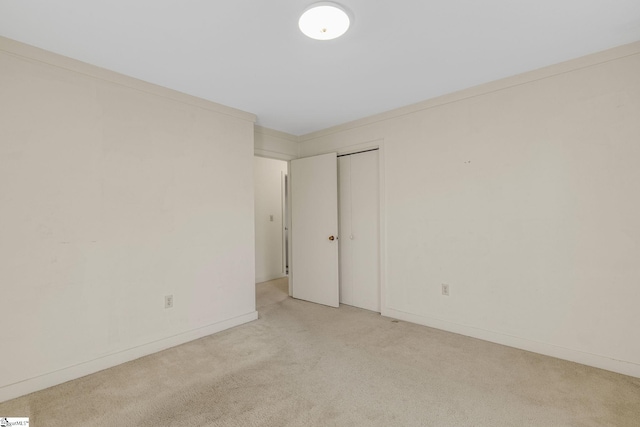 carpeted empty room with ornamental molding