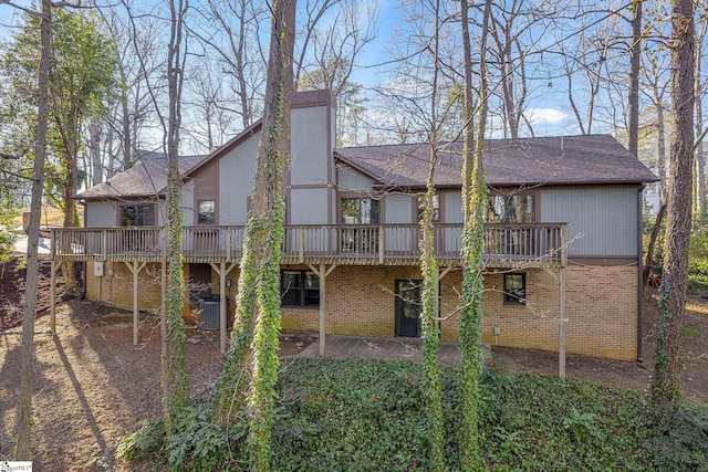 back of house featuring a deck and central air condition unit