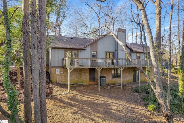 back of house with central AC and a deck