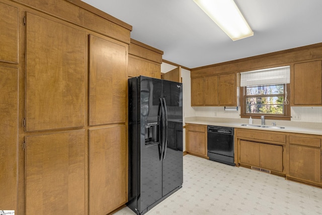 kitchen featuring black appliances and sink