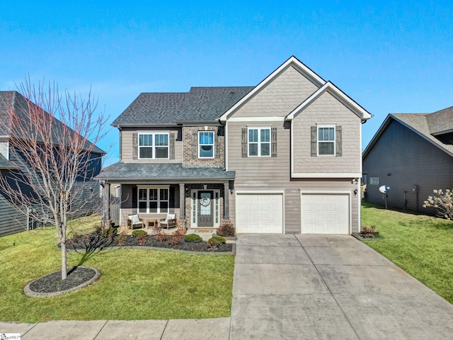 view of front of house with a front yard, a porch, and a garage