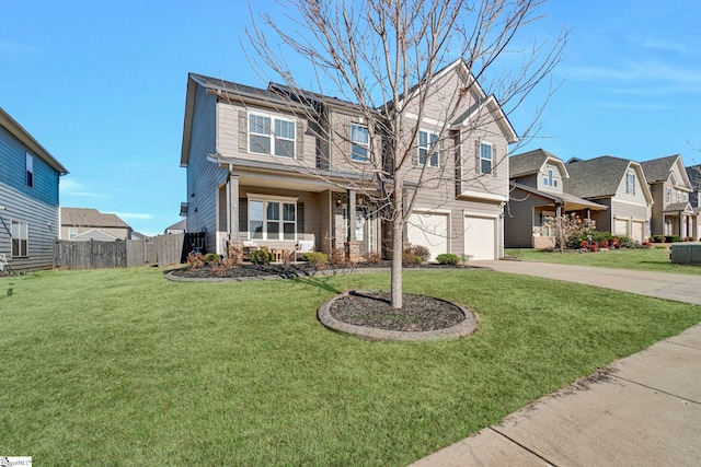 view of front of house featuring a garage, a front yard, and a porch