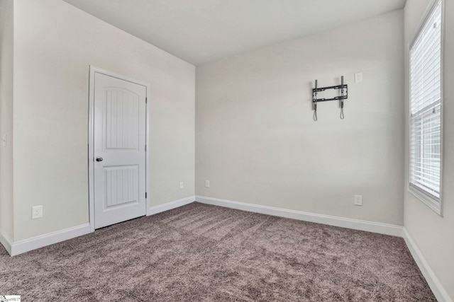 unfurnished room with carpet