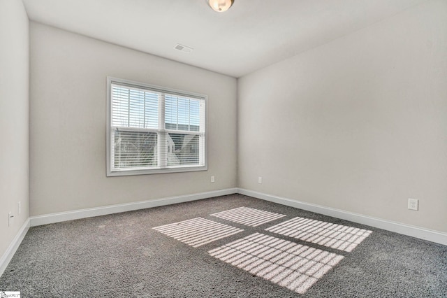 spare room featuring carpet floors