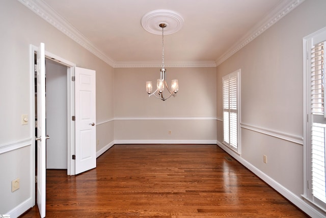 unfurnished dining area featuring a notable chandelier, crown molding, and dark hardwood / wood-style floors