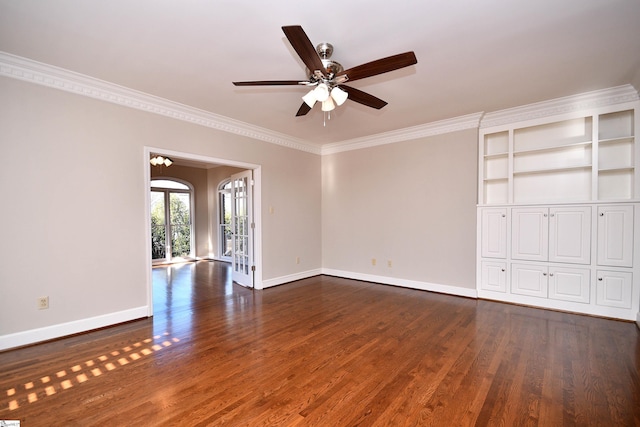 unfurnished room with ornamental molding, ceiling fan with notable chandelier, and dark hardwood / wood-style flooring