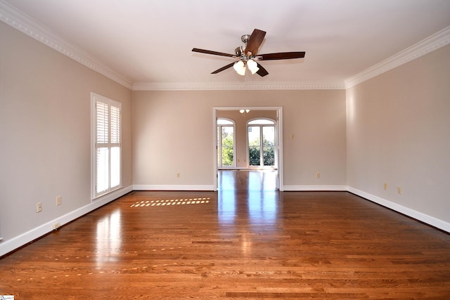 unfurnished room featuring ceiling fan, dark hardwood / wood-style flooring, and crown molding