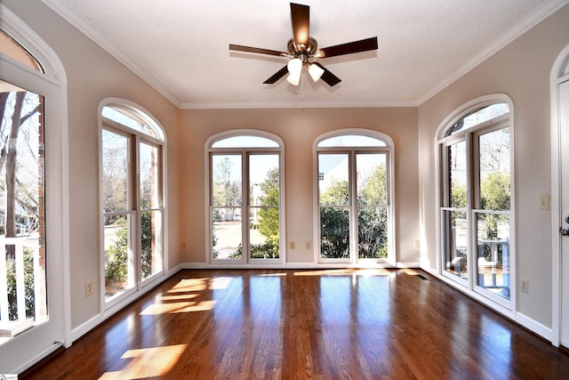 unfurnished sunroom with ceiling fan