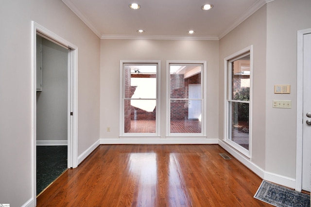 interior space featuring dark hardwood / wood-style flooring and crown molding