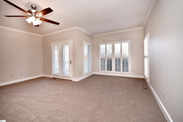 carpeted empty room with ceiling fan and ornamental molding