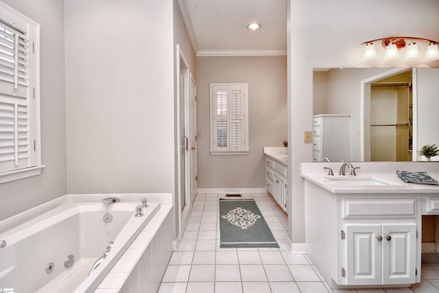 bathroom featuring vanity, tile patterned floors, crown molding, and tiled tub