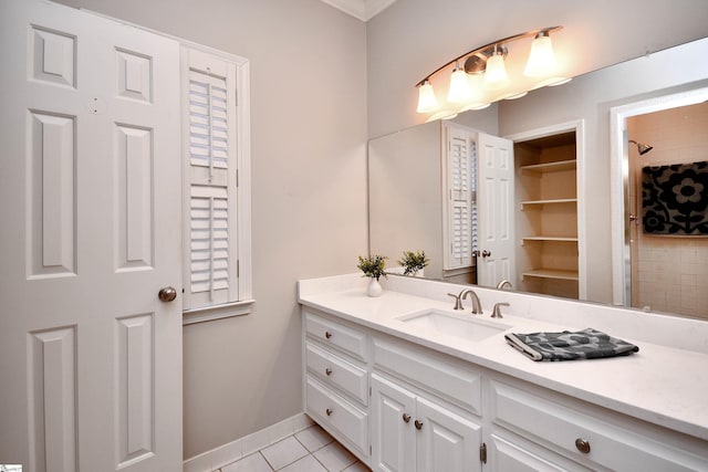 bathroom with tile patterned floors and vanity