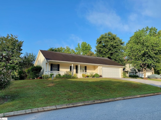 ranch-style house featuring a front lawn, a garage, and a porch