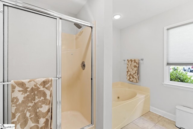 bathroom featuring separate shower and tub, tile patterned floors, and toilet