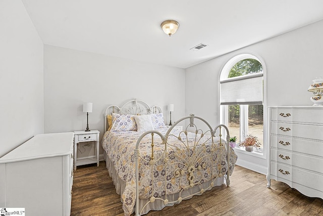 bedroom featuring dark hardwood / wood-style floors