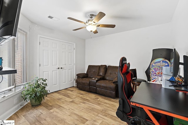 office area with ceiling fan and light hardwood / wood-style flooring