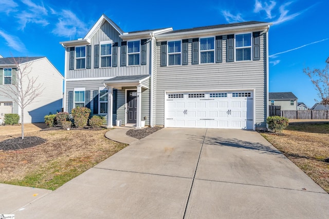 view of front of home featuring a front yard and a garage