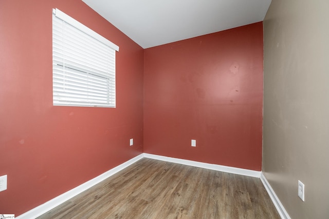 unfurnished room featuring hardwood / wood-style flooring